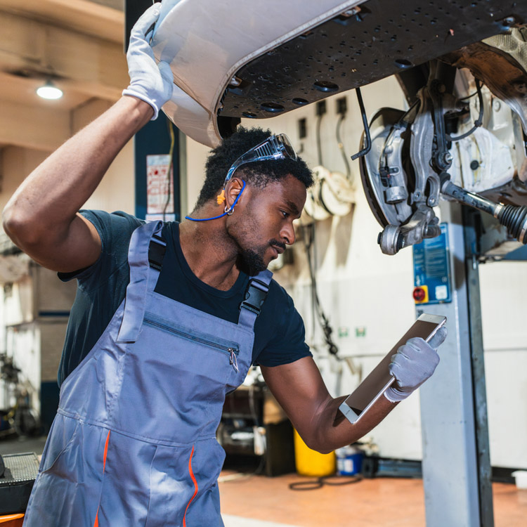 Mechanic at work reviewing social media ads