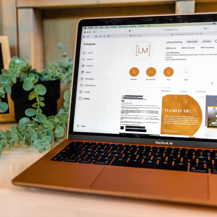 Lure Marketing Website Looking at Lure Marketing social media page on a laptop