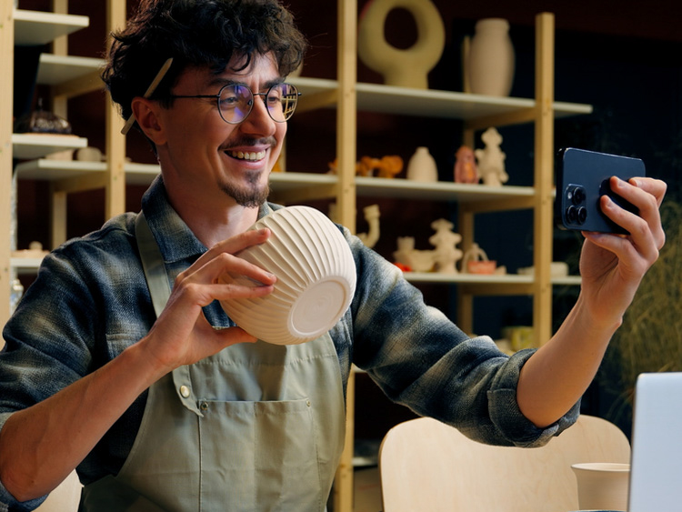 Small business owner taking photo of products for social media advertising